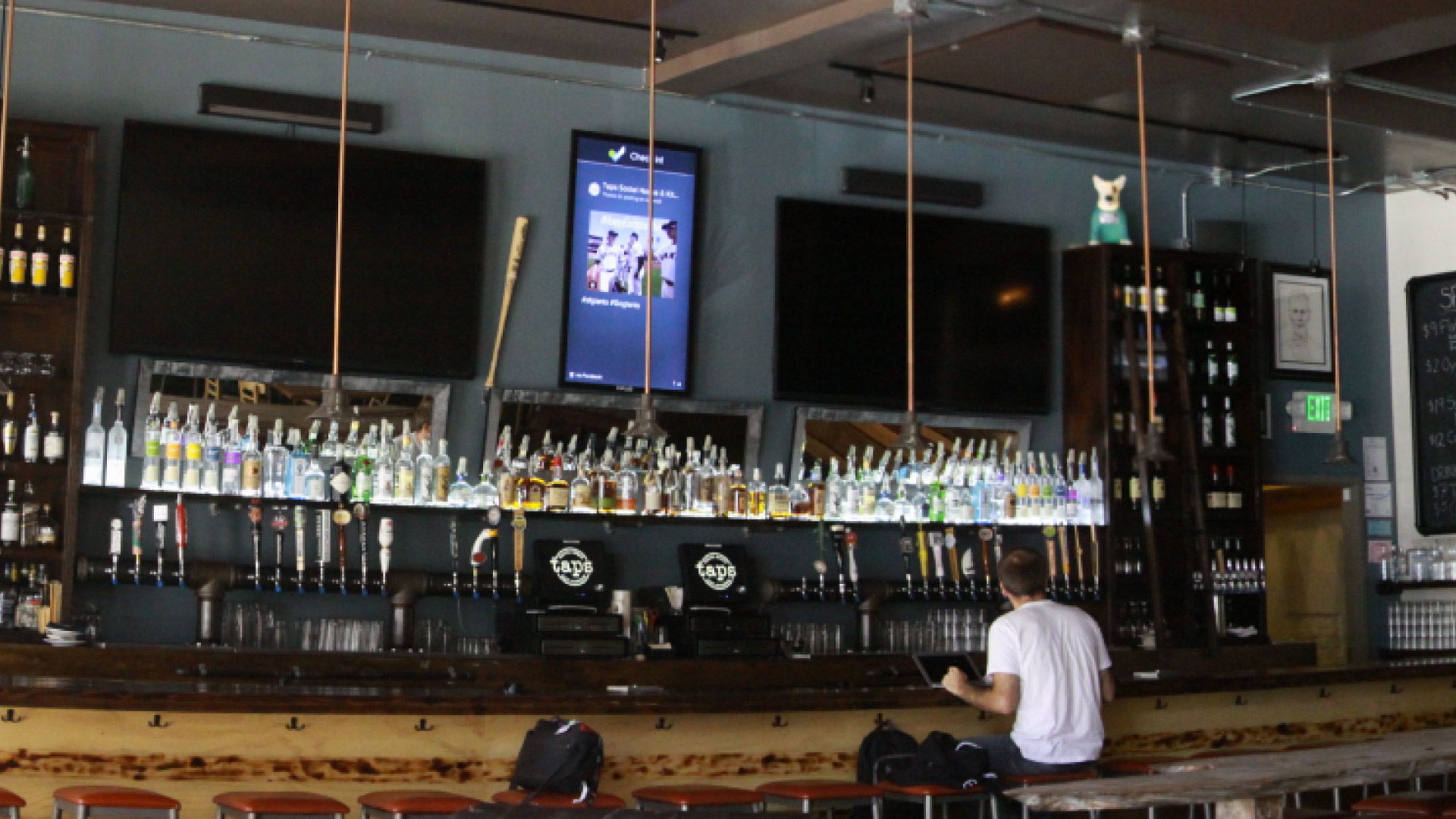 man sitting at a bar