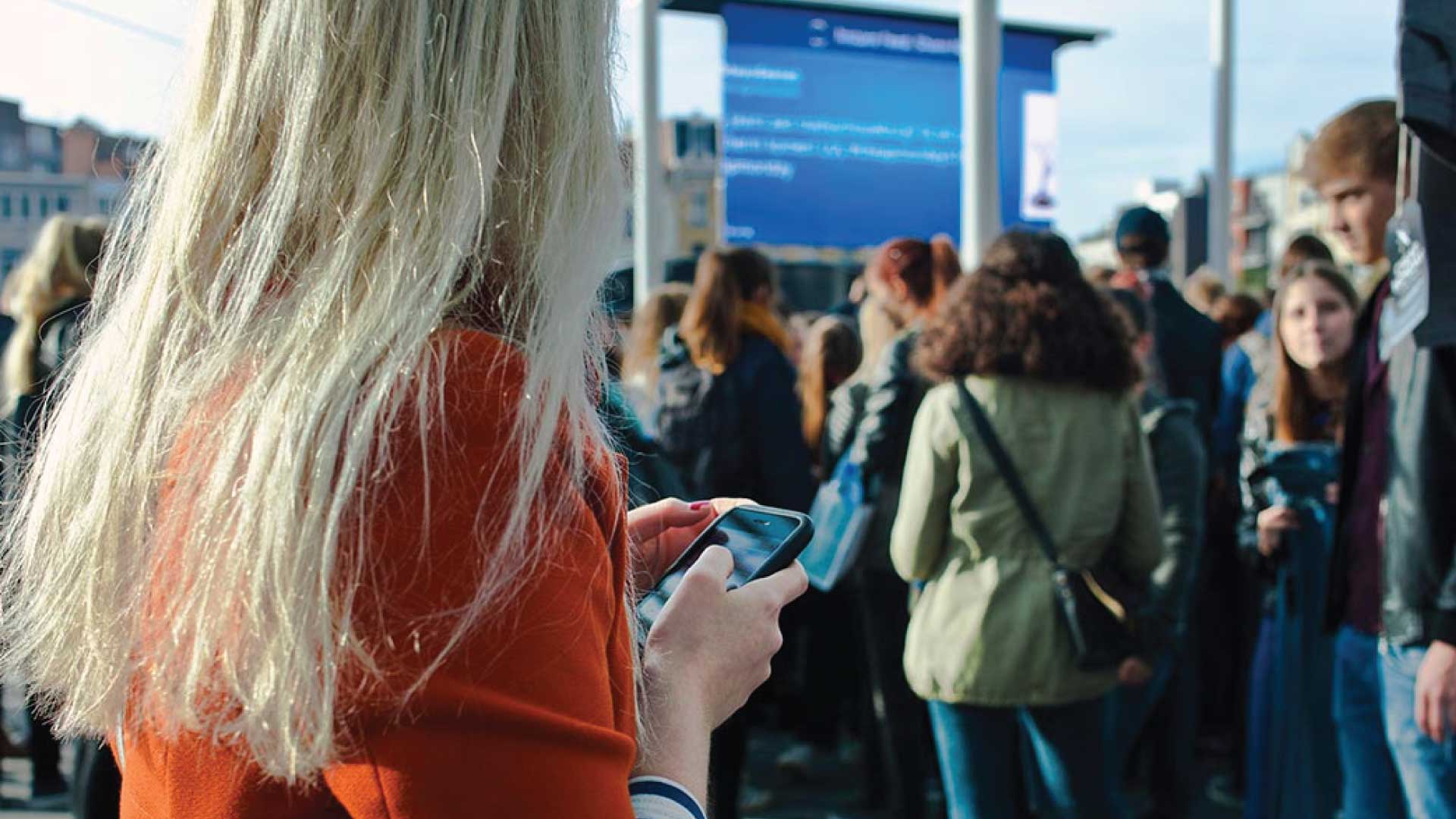 lady on phone at an event