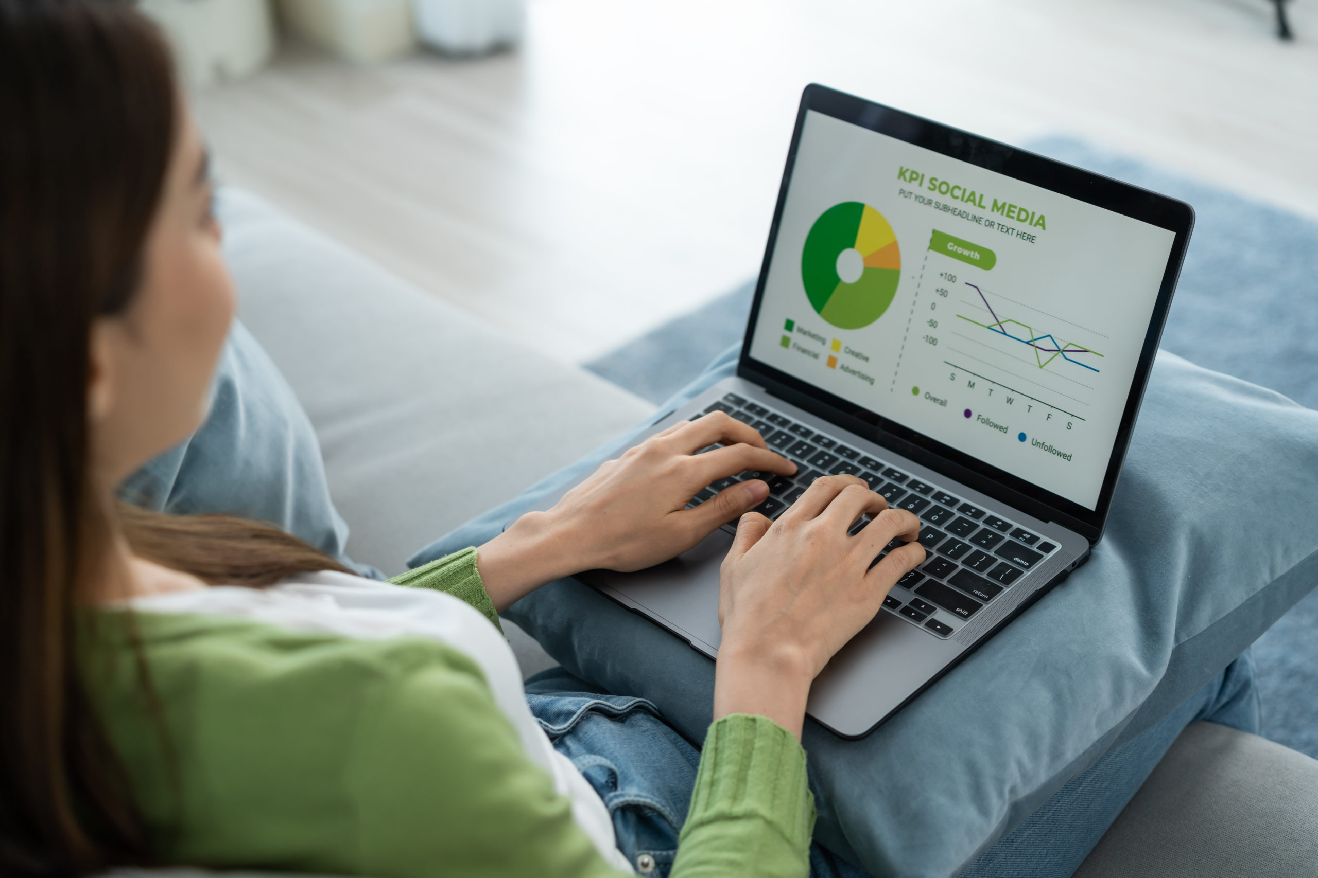 woman working on kpi graph on computer