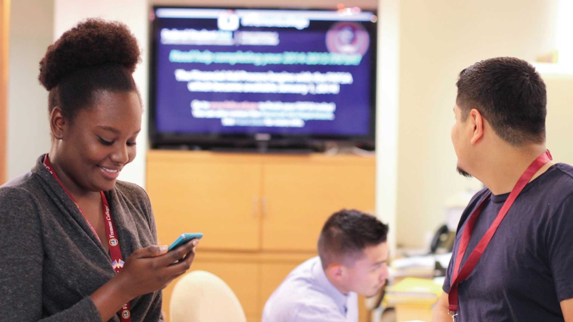 teachers around a display screen