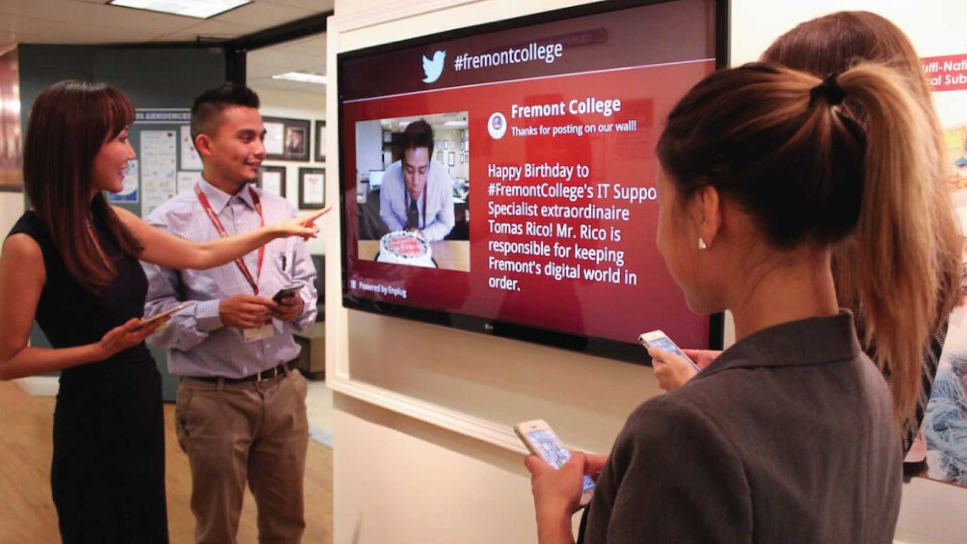 teacher group discussing an image on a wall display