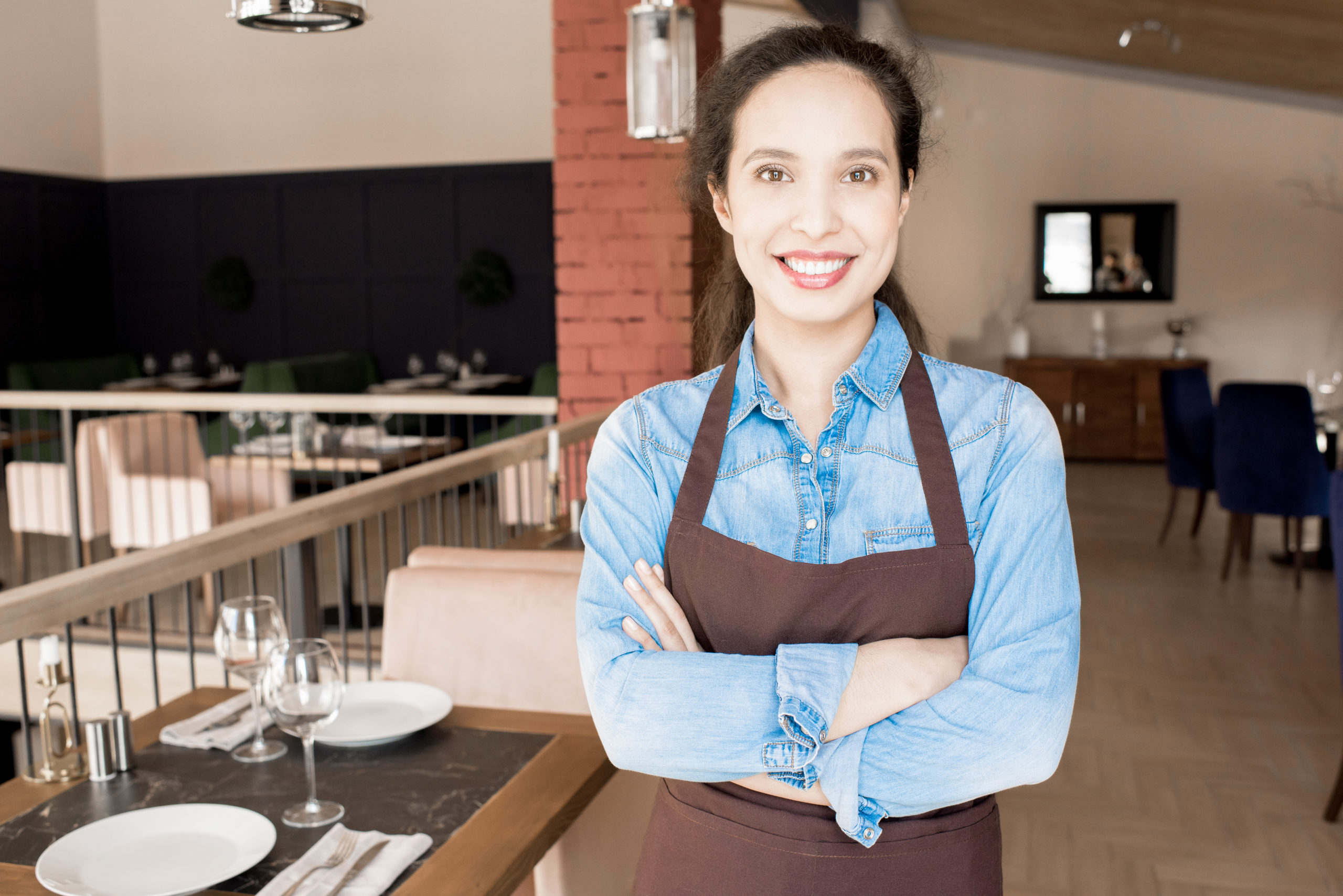 Positive optimistic waitress in apron