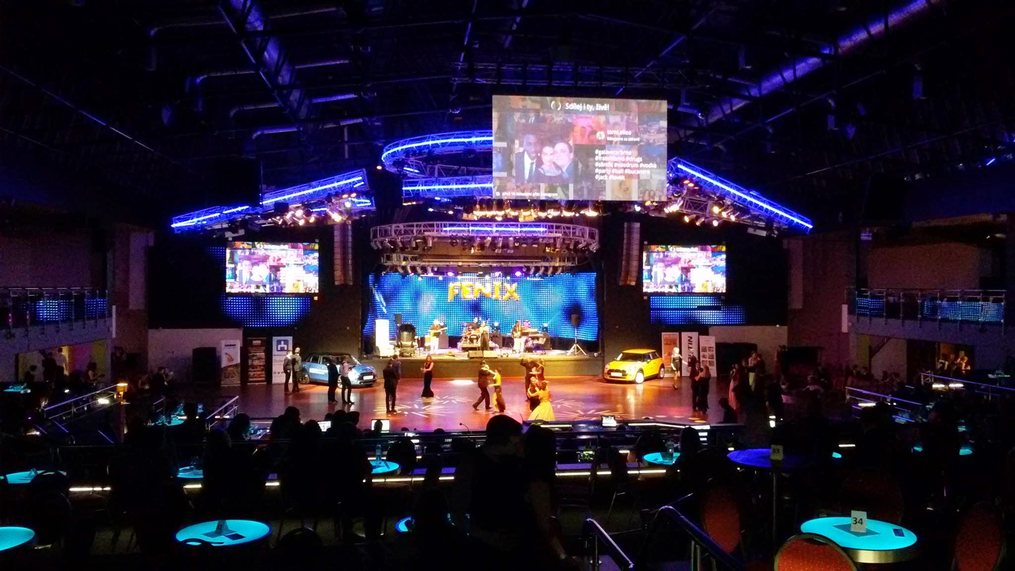 convention center with a stage full of large video displays