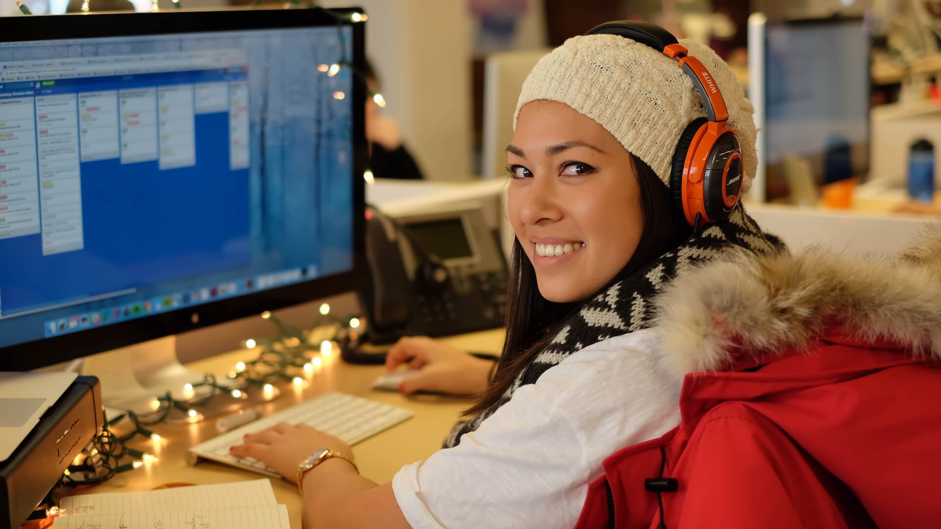woman smiling working on computer