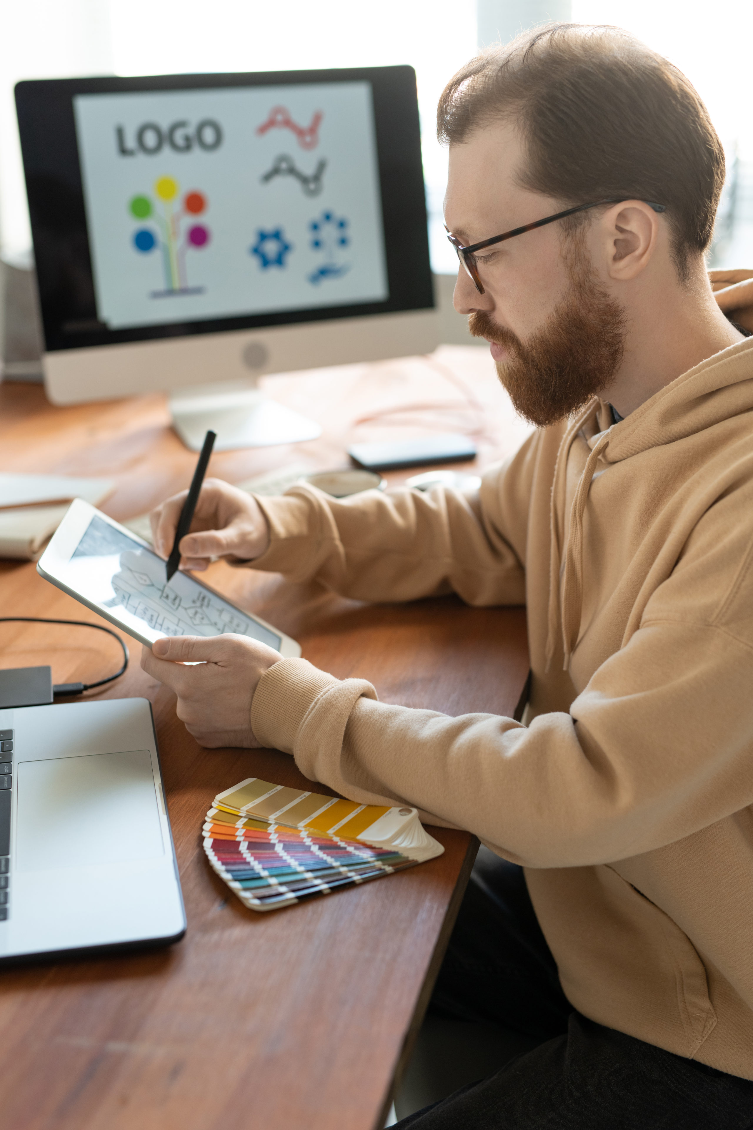 man working on branding at desk