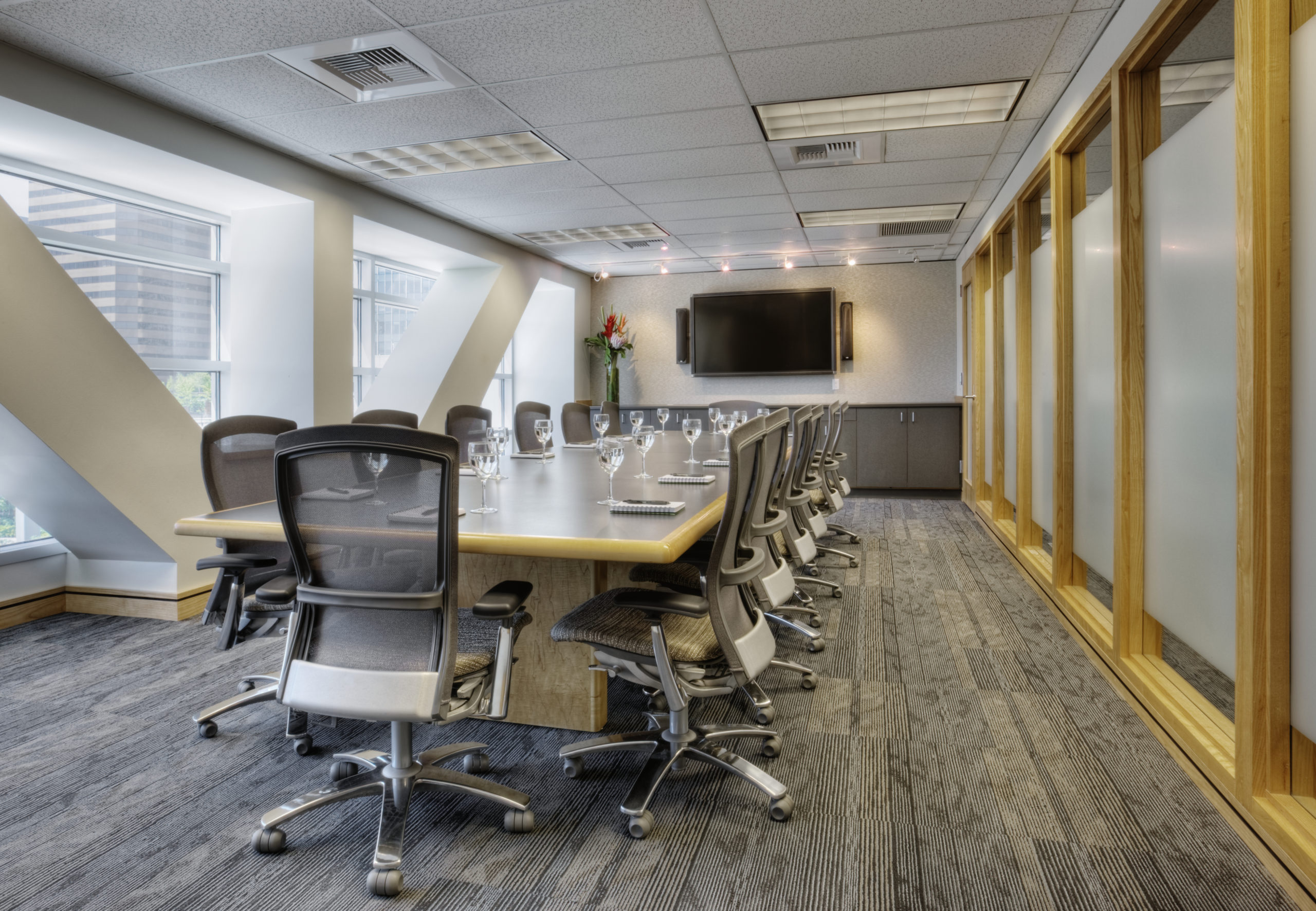 empty conference room with a display screen on wall