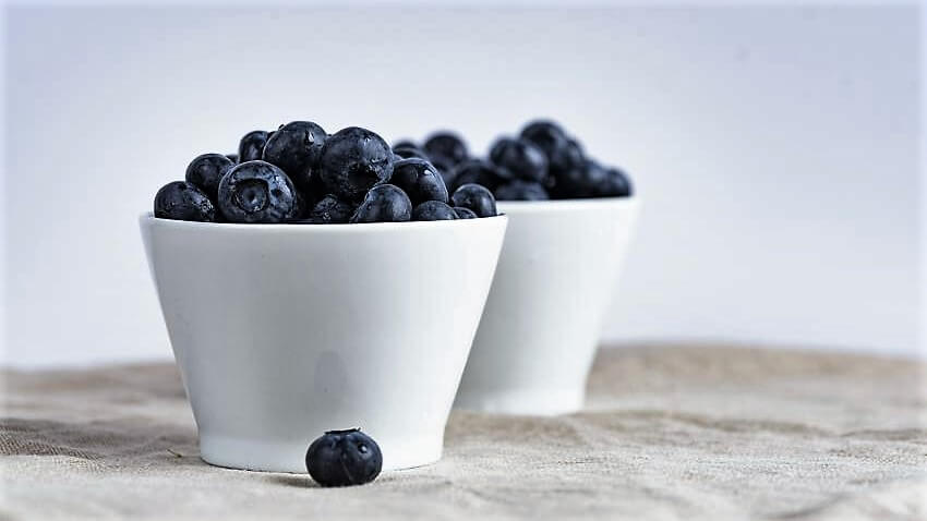 two cups full of blueberries