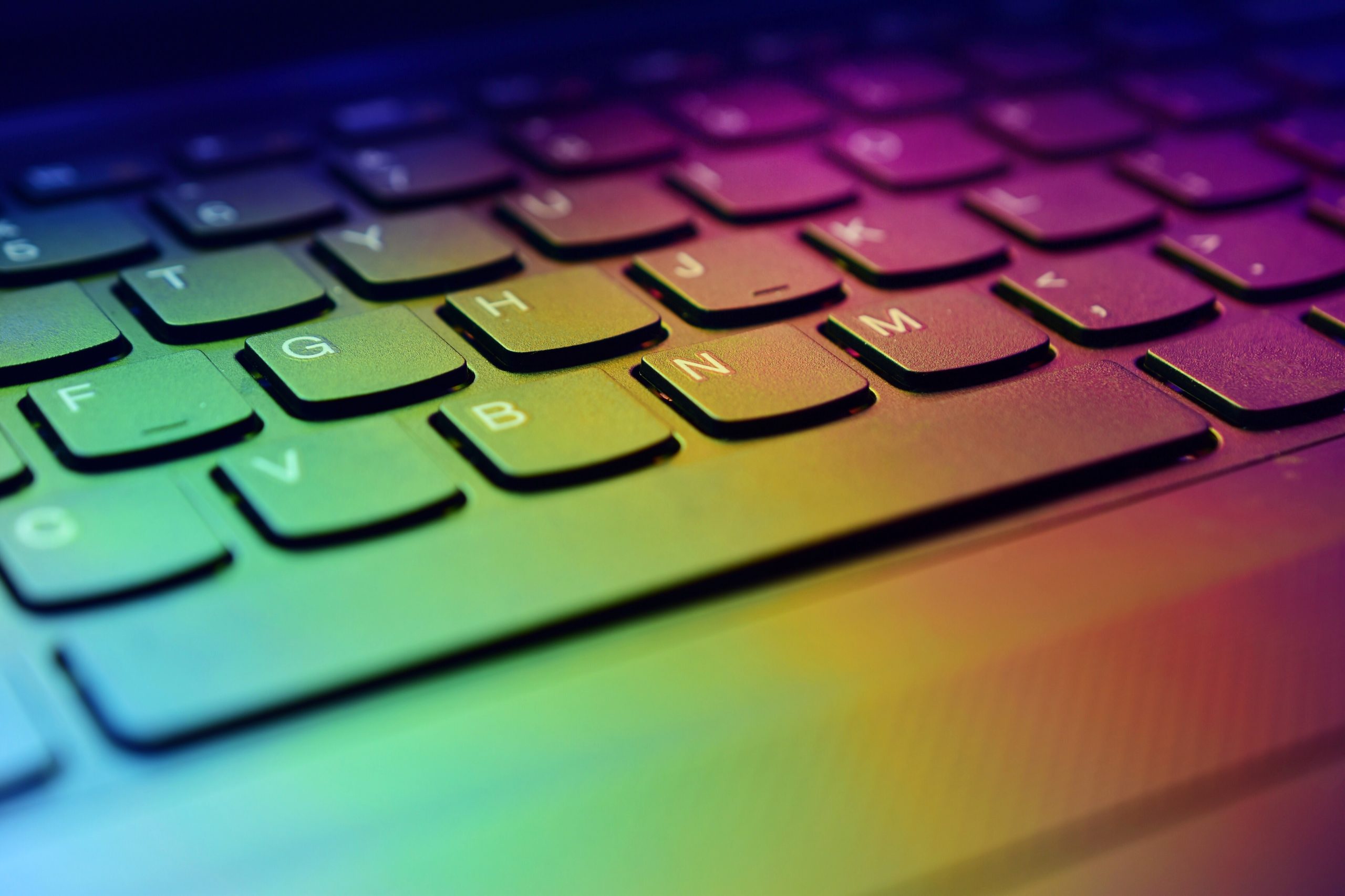 computer keyboard with multi color lighting across it