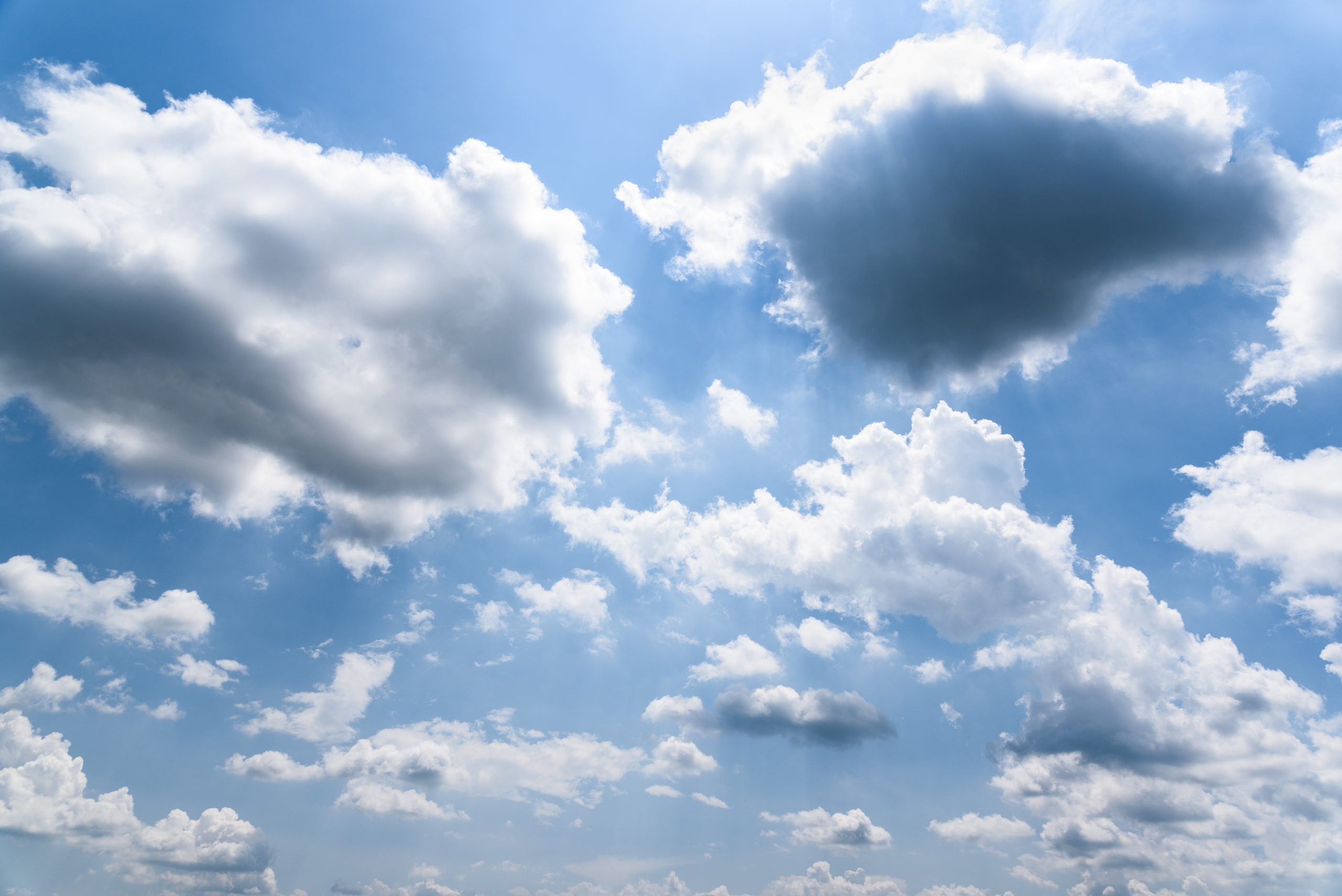 image of clouds with sun shining through