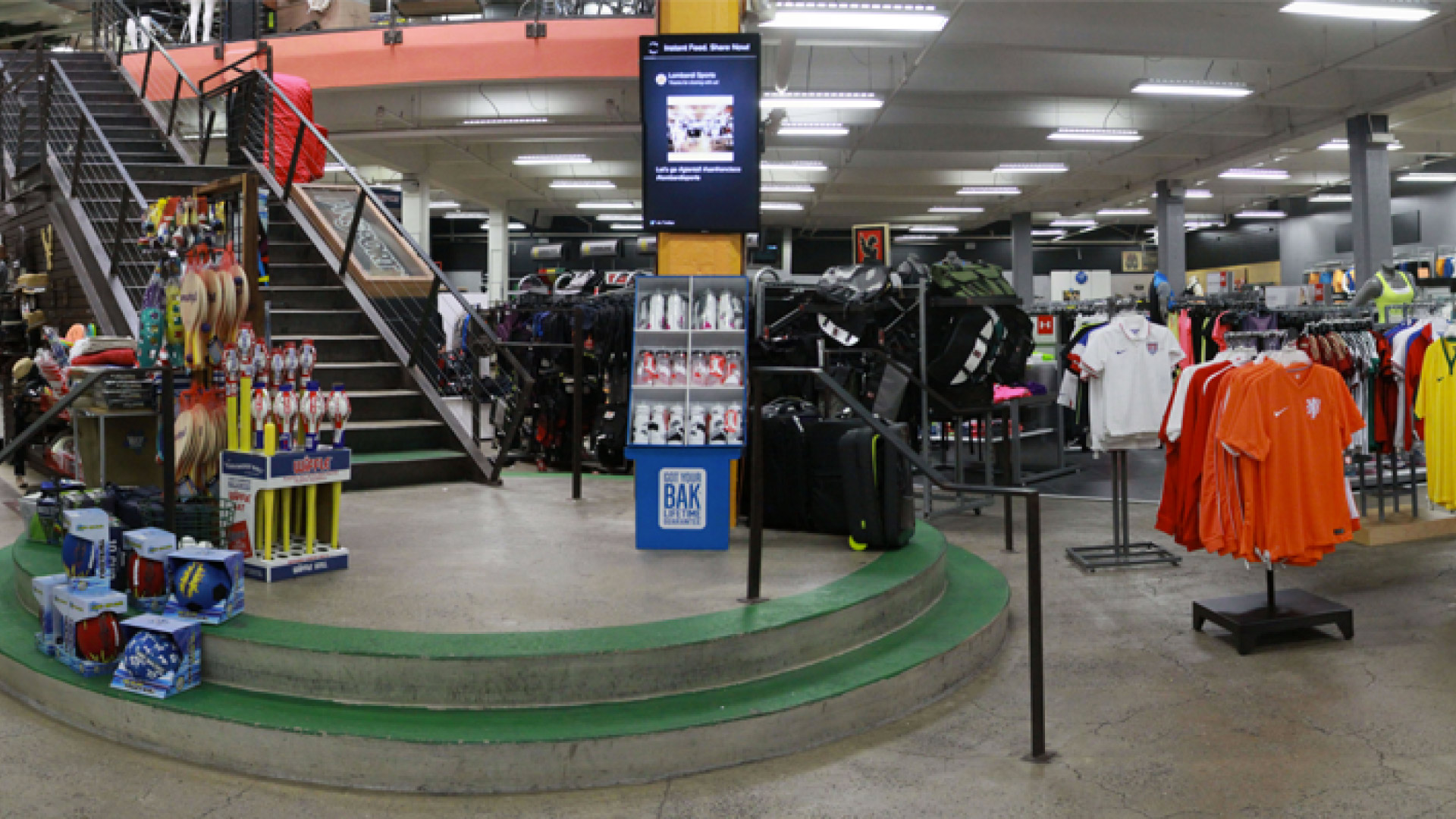 interior of sports store with digital signs on posts