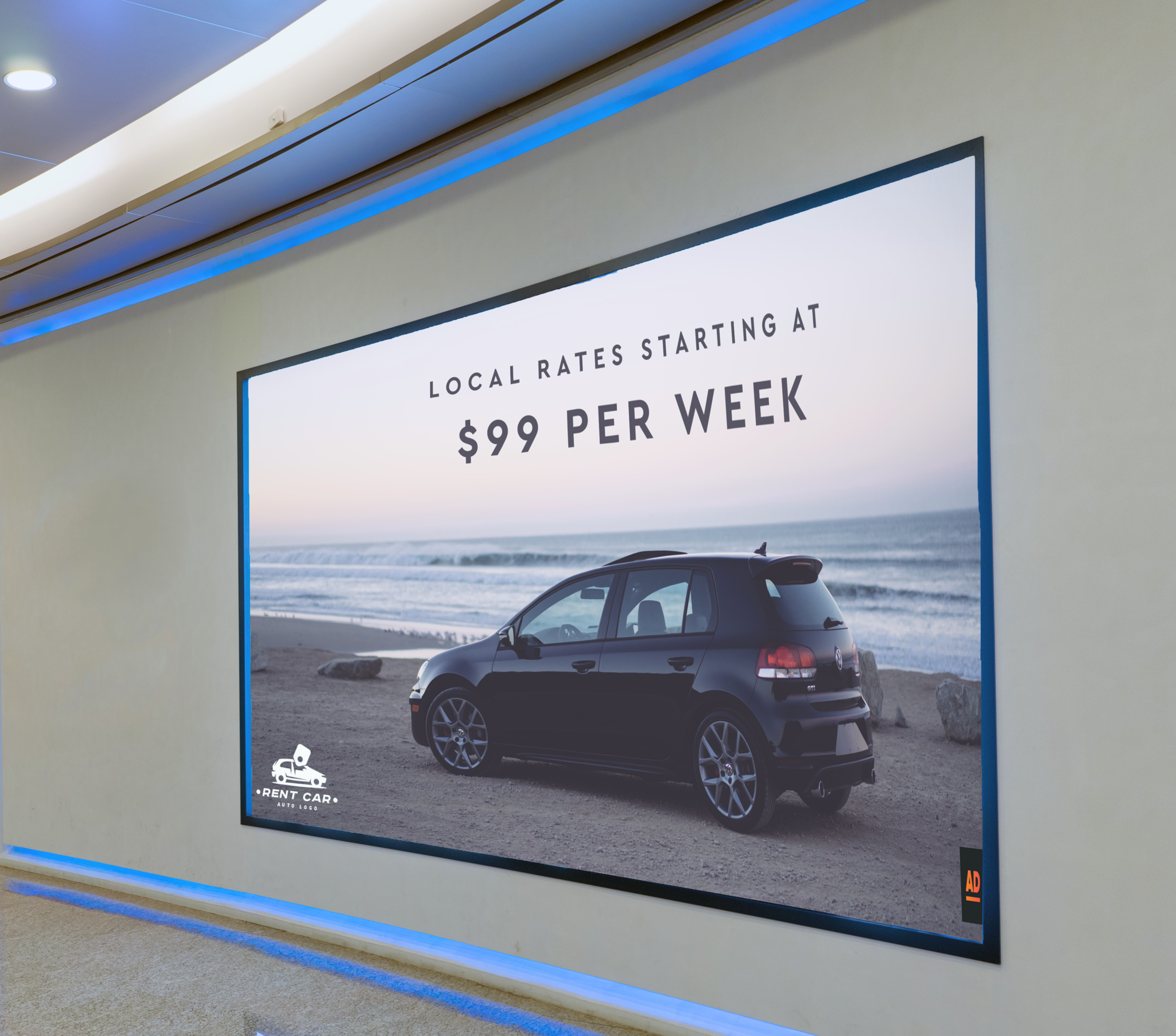 Automotive video wall showing a blue hatchback car on a beach with a promotional discount overhead.