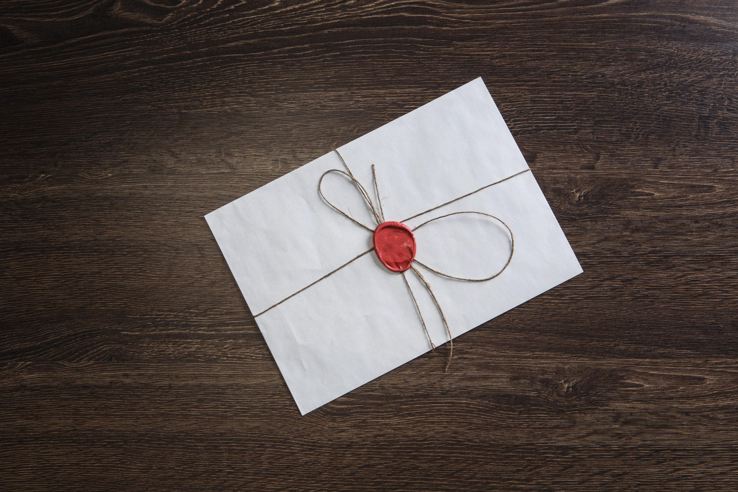 letter with seal on a table