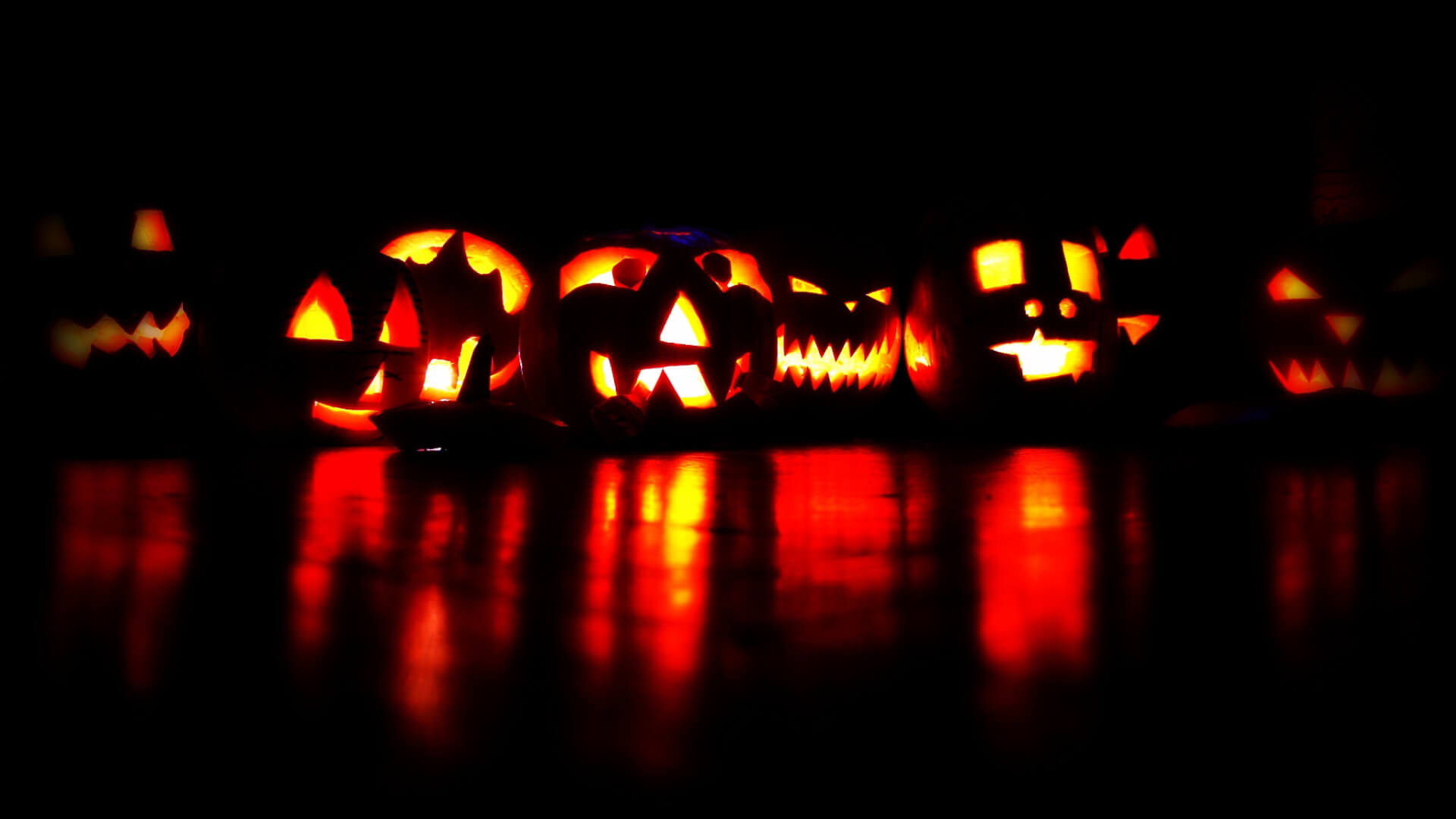 jack-o-lanterns lit up at night