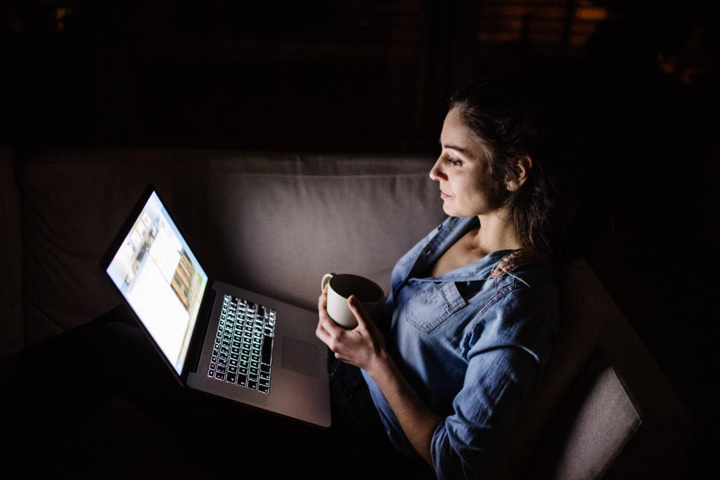 Woman using laptop to view medical information