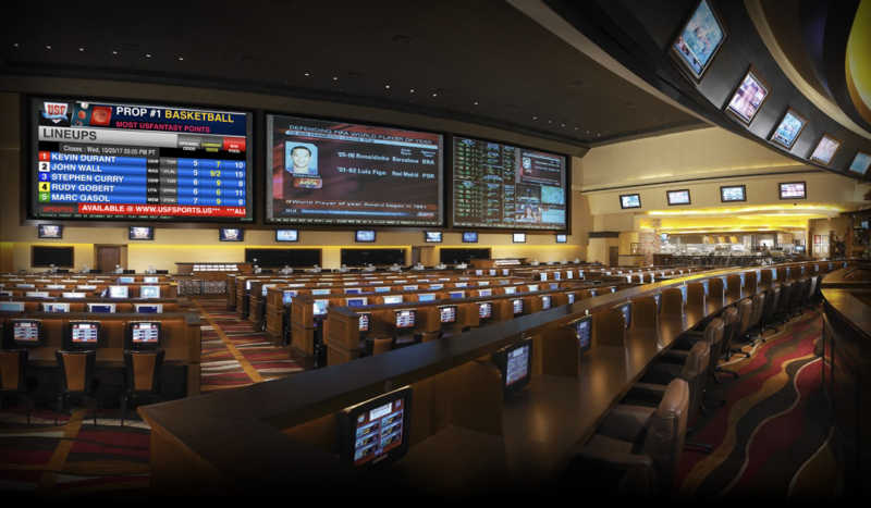 large displays at a sports section of a casino with seating