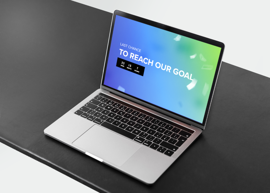 laptop with a message on screen explaining reaching goals