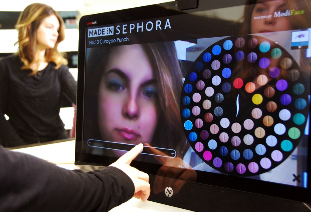 person using an interactive makeup display