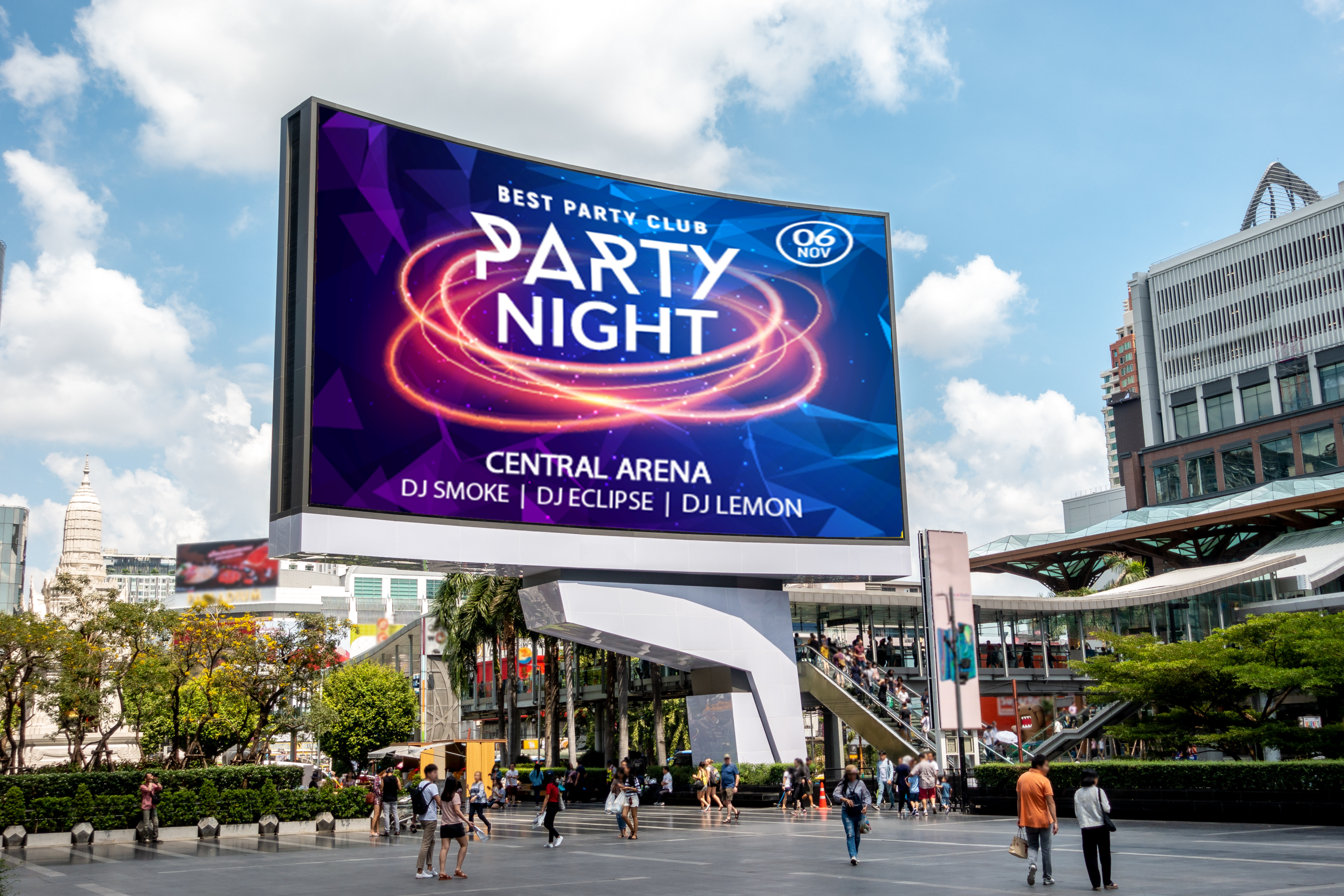 Large LED screen advertising "party night" in an outside pedestrian area