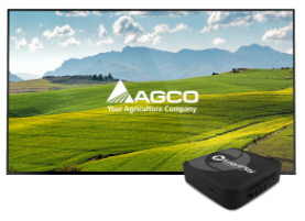 Display with AGCO logo over a farm image