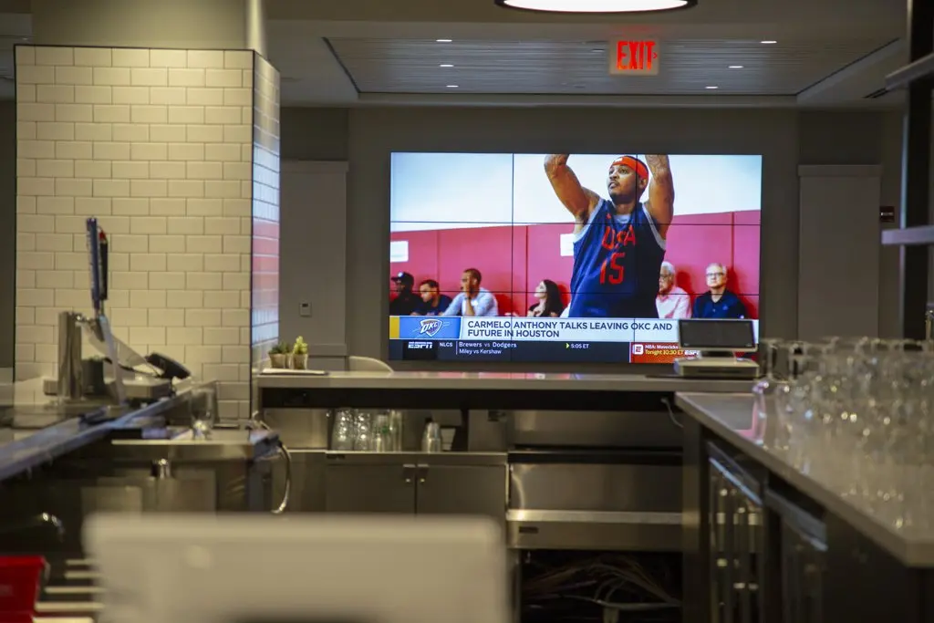 Interior of concessions with digital signage at enterprise center