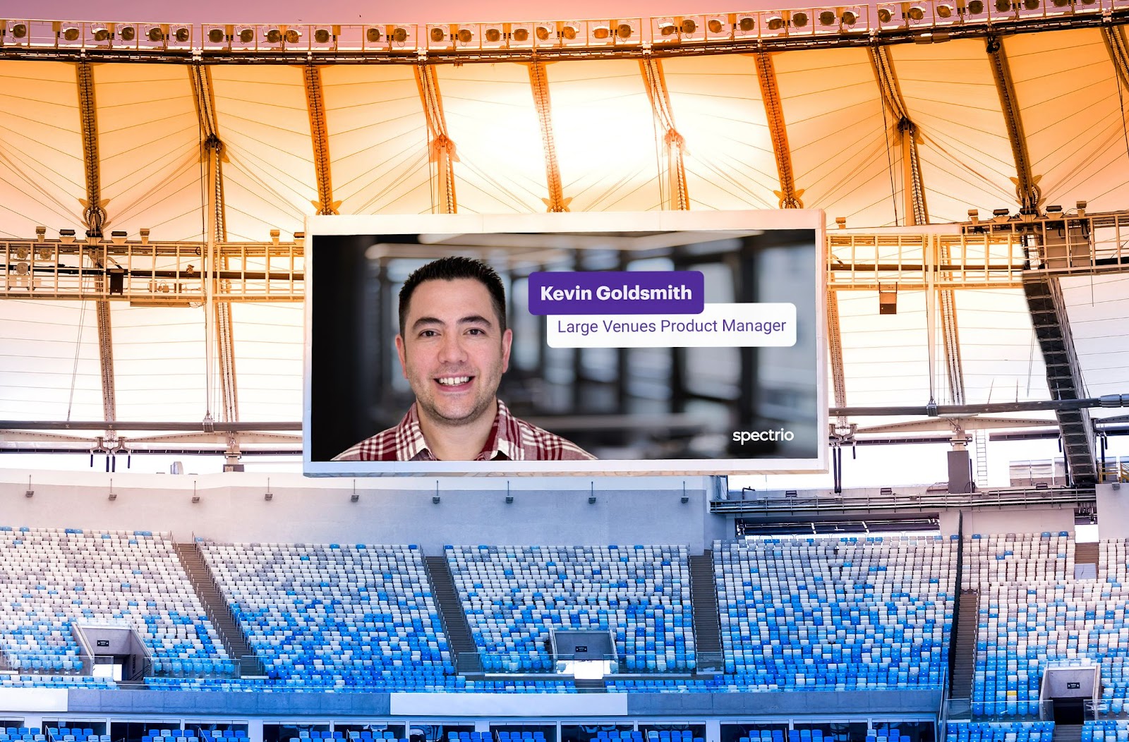 Photo of a full stadium with an image of a man and his bio on the screen