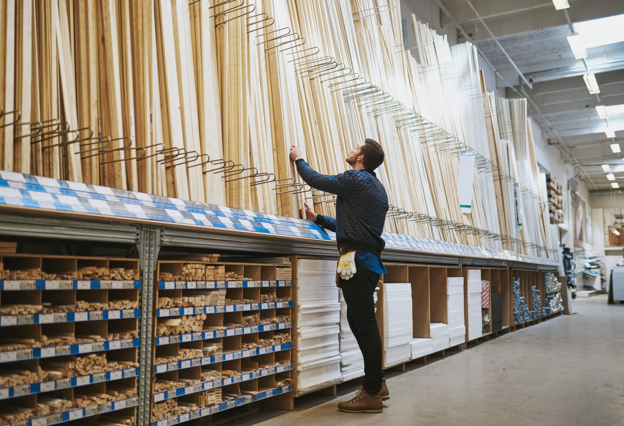 Man selecting lumber at a store