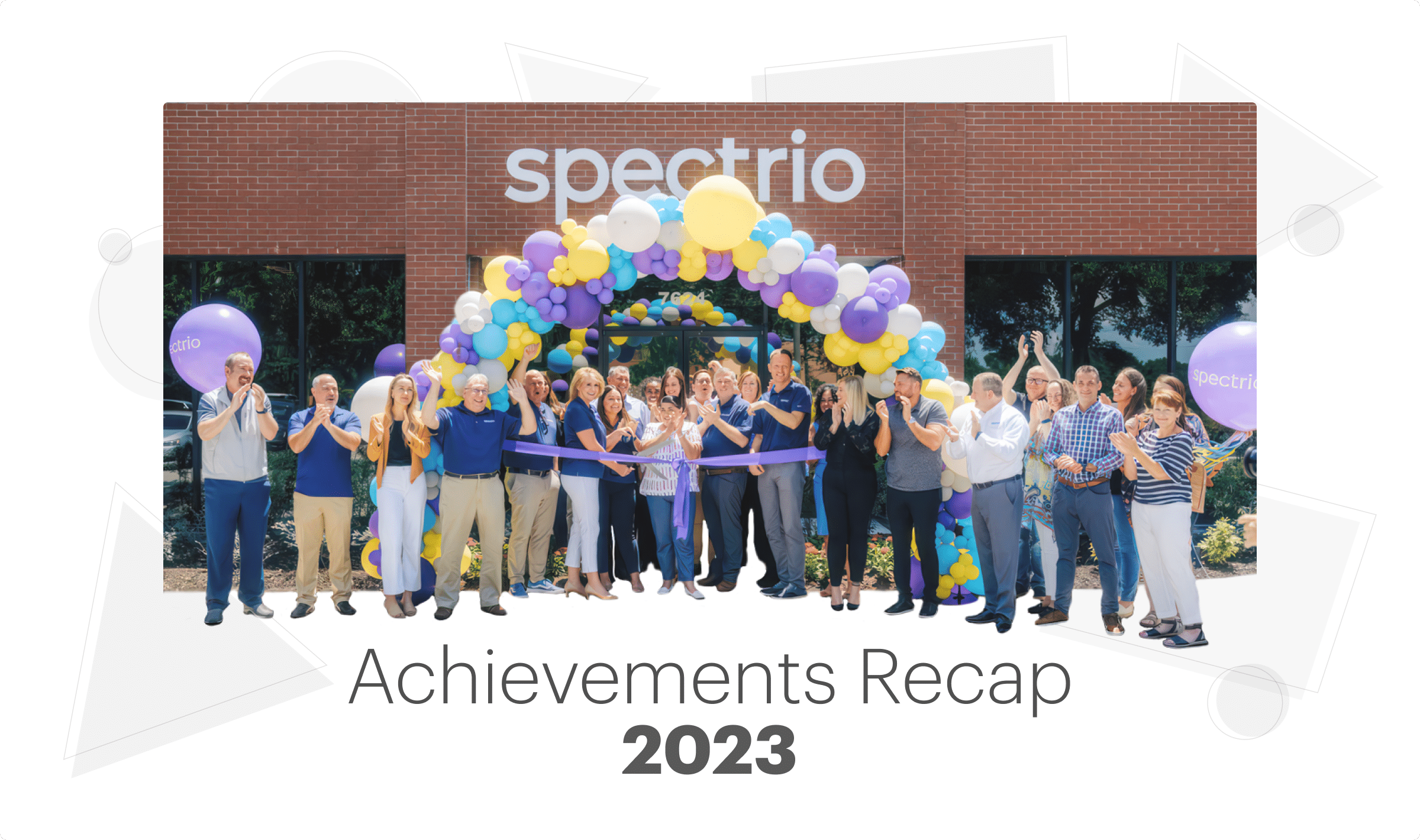 Spectrio employees celebrating outside of their office