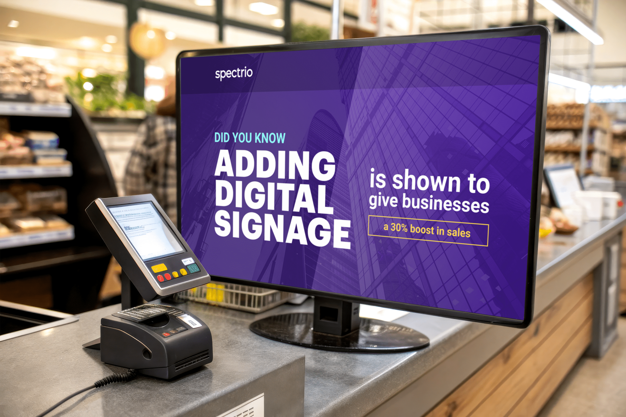 Checkout counter display with Spectrio signage on the display