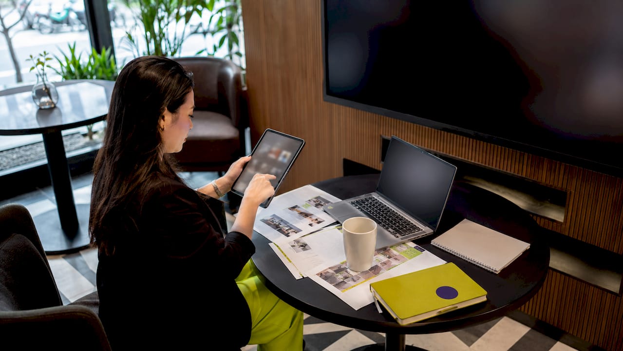 Professional reviewing lobby display content