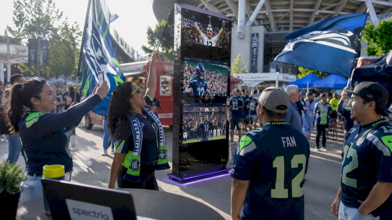 Fans viewing LED displays in sports arena